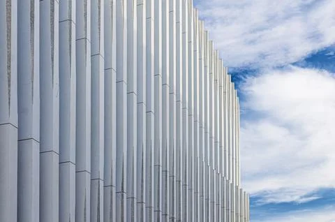 Patterned vertical stripes, columns structure of modern design building wall  Stock Photos