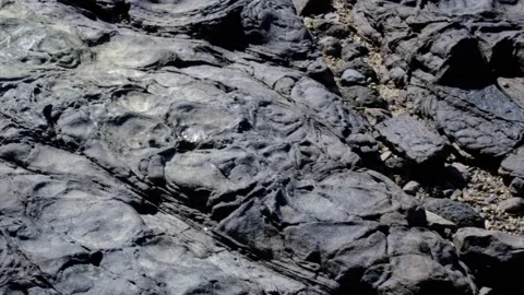 Patterned volcanic rock formations on Mantaray Island Nanuya Balavu in Yasawa Stock Footage 342952998