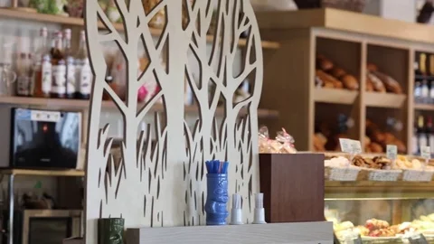 Patterned wall and shelves with bread in the cafe-bakery, slow motion Stock Footage 84964776