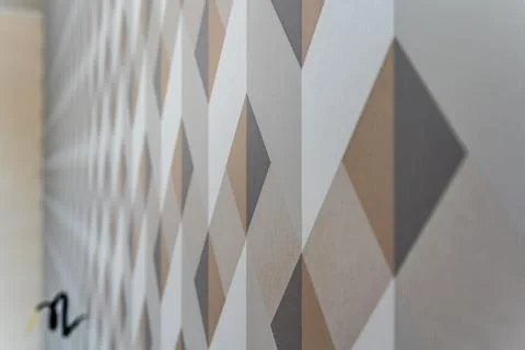 A patterned wallpaper with brown and white squares Stock Photos