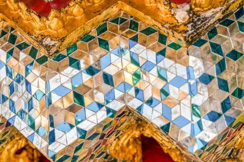 Patterned walls, frames, and roof edges create a rich study of Thai temple .. Stock Photos