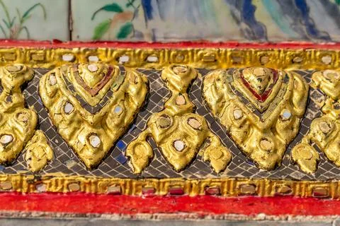 Patterned walls, frames, and roof edges create a rich study of Thai temple .. Foto stock
