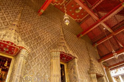 Patterned walls, frames, and roof edges create a rich study of Thai temple .. 写真素材