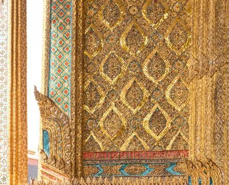 Patterned walls, frames, and roof edges create a rich study of Thai temple .. 스톡 사진