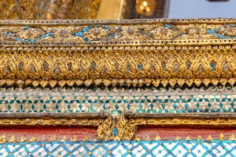 Patterned walls, frames, and roof edges create a rich study of Thai temple .. 写真素材