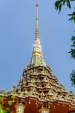 Patterned walls, frames, and roof edges create a rich study of Thai temple .. 스톡 사진