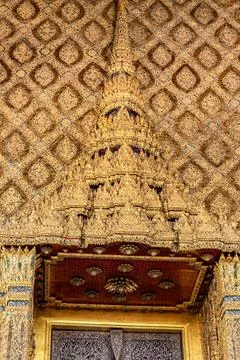 Patterned walls, frames, and roof edges create a rich study of Thai temple .. 写真素材