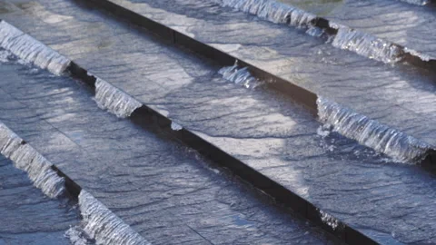 Patterned waterflow on concrete steps on Louis Vuitton Foundation, Paris, France Stock Footage 245460222
