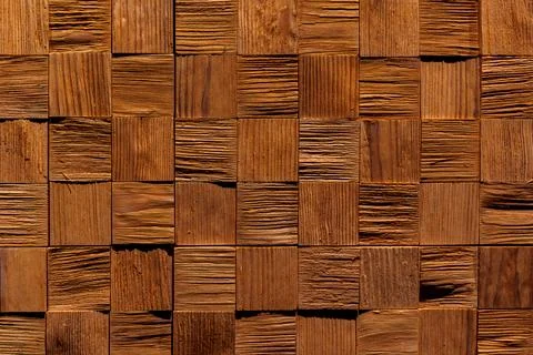 Patterned wooden wall surface with square tiles. Stock Photos