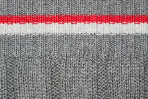 Patterned woolen yarn, knitted texture, red, white, and gray Stock Photos