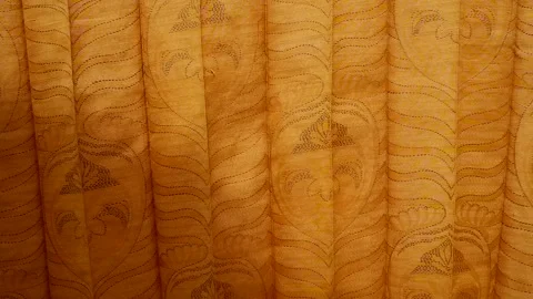 The patterned yellow fabric stood out under the sunlight Stock Footage 306705266