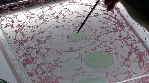 Patterning paints on the white surface of the water Stock Footage 42556194