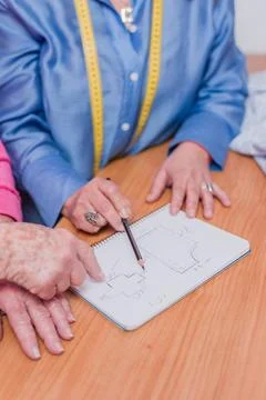 Patternmaking designer needlewoman make handmade manufacturing clothes Stock Photos