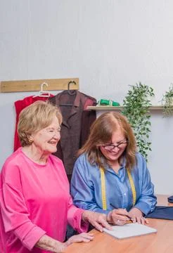 Patternmaking seamstress making a handmade dress. clothes manufacturing. mature Stock Photos