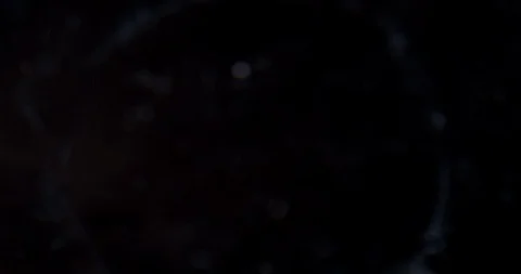 Patterns and reflections from coins dropped in water Stock Footage 112332807