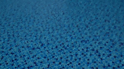 Patterns and ripples of swimming pool blue water surface background. Stock Footage 108736729