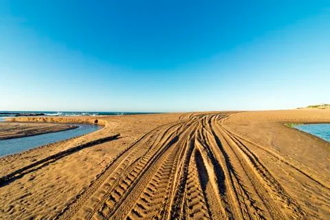 Patterns and Texture of Vehicle Tracks on Beach Sand Stock Photos