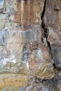 Patterns and textures of a rock wall Stock Photos