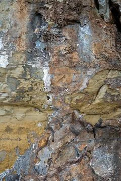 Patterns and textures of a rock wall Stock Photos