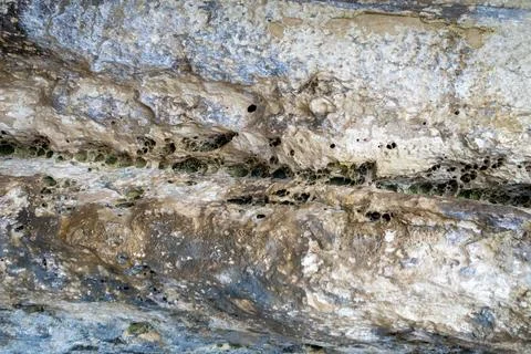 Patterns and textures of a rock wall Stock Photos