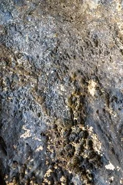 Patterns and textures of a rock wall Stock Photos