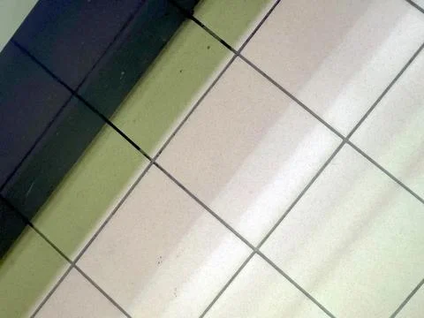 Patterns of Ceramic Tiles in a Modern Indoor Space During Daylight Hours Stock Photos