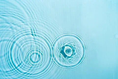 Patterns from Circles from drops on clear water Stock Photos