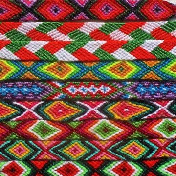 Patterns of color in a row of Native American woven bracelets. Stock Photos
