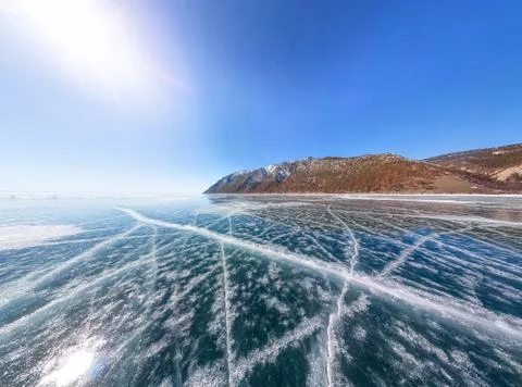 Patterns of cracks on a blue winter ice of Lake Baikal from Olkhon Stock Photos