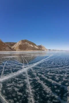 Patterns of cracks on a blue winter ice of Lake Baikal from Olkhon Stock Photos