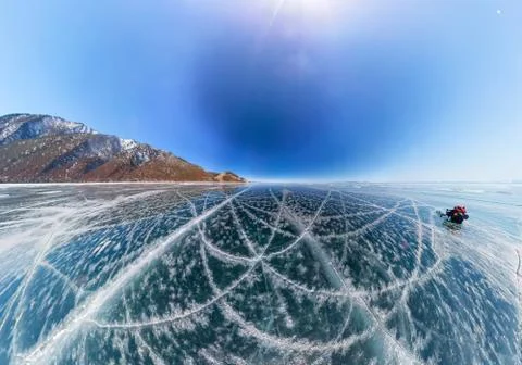 Patterns of cracks on a blue winter ice of Lake Baikal from Olkhon Stock Photos