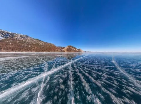 Patterns of cracks on a blue winter ice of Lake Baikal from Olkhon Stock Photos