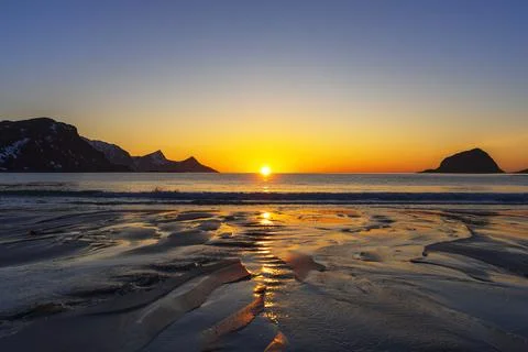 Patterns created by the small river on a sandy beach at sunset, Vik beach, Stock Photos