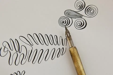 Patterns drawn with an ink pen on a white paper sheet with stripes drawn. sta Stock Photos