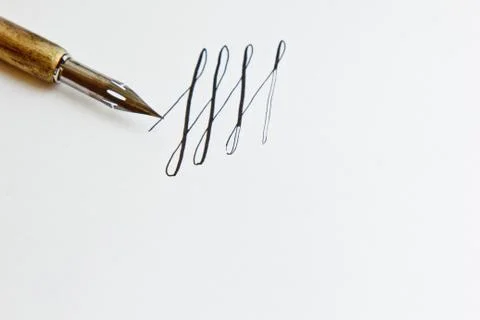 Patterns drawn with an ink pen on a white paper sheet with stripes drawn. sta Stock Photos
