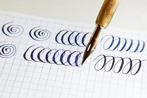 Patterns drawn with an ink pen on a white paper sheet with stripes drawn. sta 스톡 사진