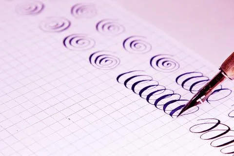 Patterns drawn with an ink pen on a white paper sheet with stripes drawn. sta 스톡 사진