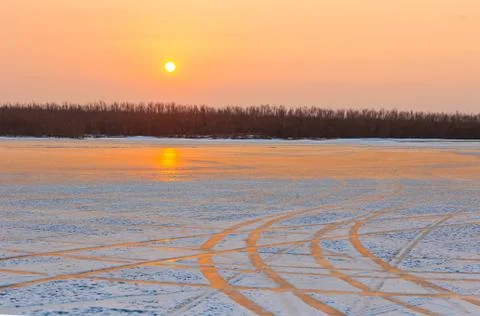 Patterns on ice and sunrise Stock Photos
