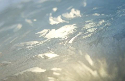 Patterns in ice on a car windscreen on a cold winter's morning Stock Photos