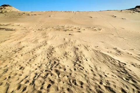 Patterns of lines, waves, footprints and dry grass in nordic dunes of Curonian Stock Photos