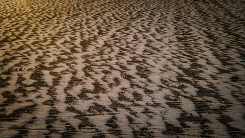 Patterns made by wind and snow in the fields Stock Photos