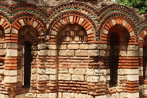 Patterns out of bricks and tiles decorate the elaborate facade of the Churc.. Stock-Fotos