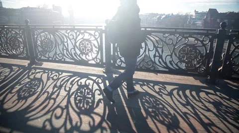 Patterns on the railing of the pedestrian bridge over the river in the sunshine. Stock Footage 43104499