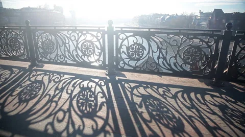 Patterns on the railing of the pedestrian bridge over the river in the sunshine. Stock Footage 43104550