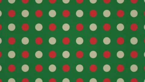 Patterns of red and cream circles on green background for Stock Footage 338224244