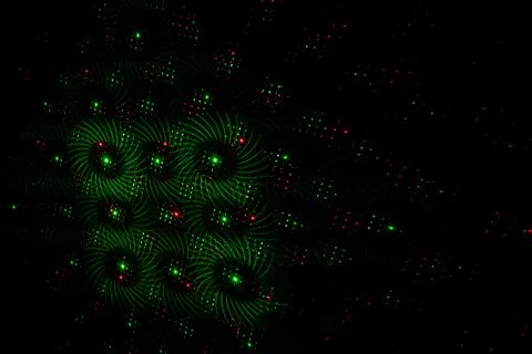 Patterns in red and green on the wall. Laser background. Party or disco conce Stock Photos