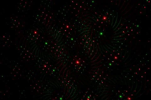 Patterns in red and green on the wall. Laser background. Party or disco conce Stock Photos