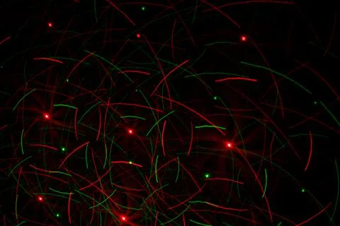 Patterns in red and green on the wall. Laser background. Party or disco conce Stock Photos