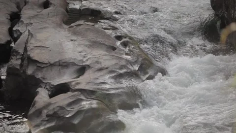 Patterns rock water surface 2 Stock Footage 169082825