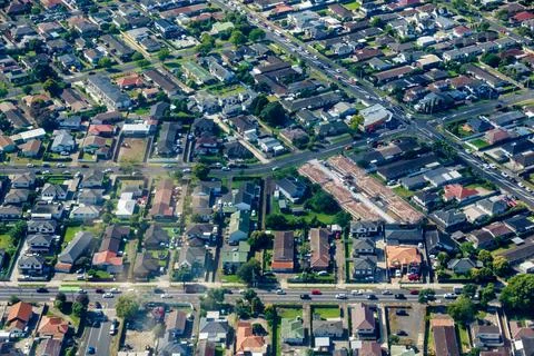 Patterns of rooftops and streets directly below in suburban zones Stock Photos
